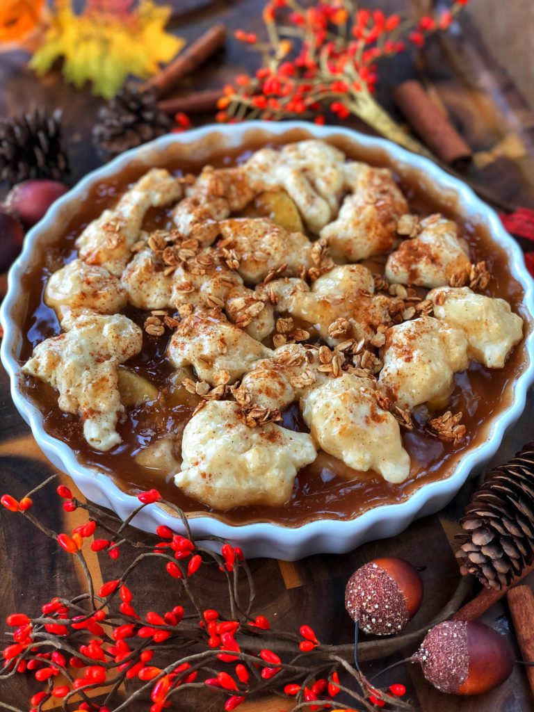 Plantiful Kiki's Vegan Apple Cobbler Being Served on a Thanksgiving Themed Dinner Table.